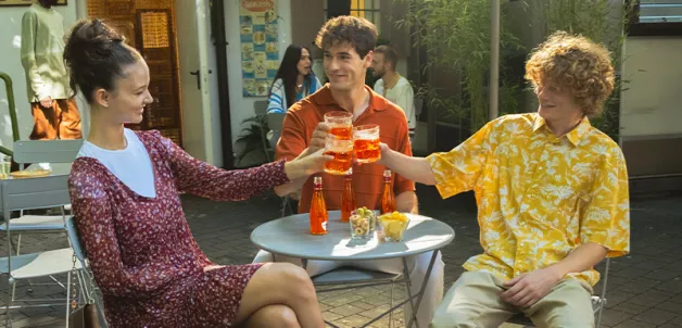 People cheering with Cocktail Sanpellegrino