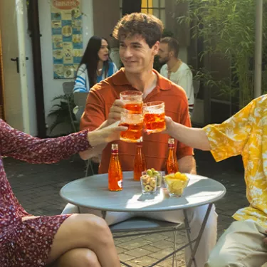 People cheering with Cocktail Sanpellegrino