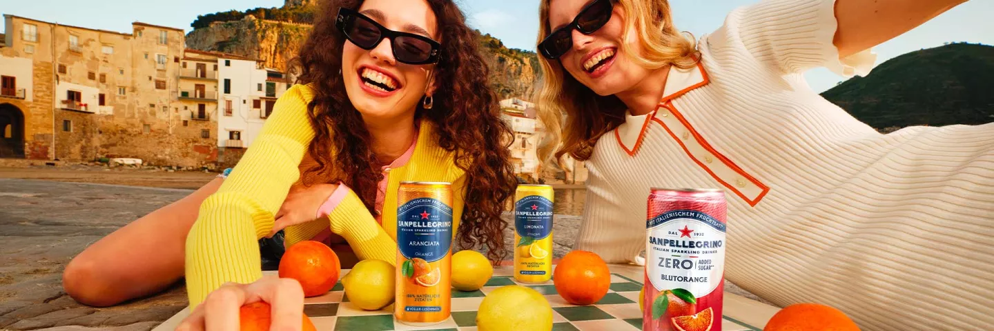 two-smiling-girls with-sanpellegrino italian-sparkling drinks