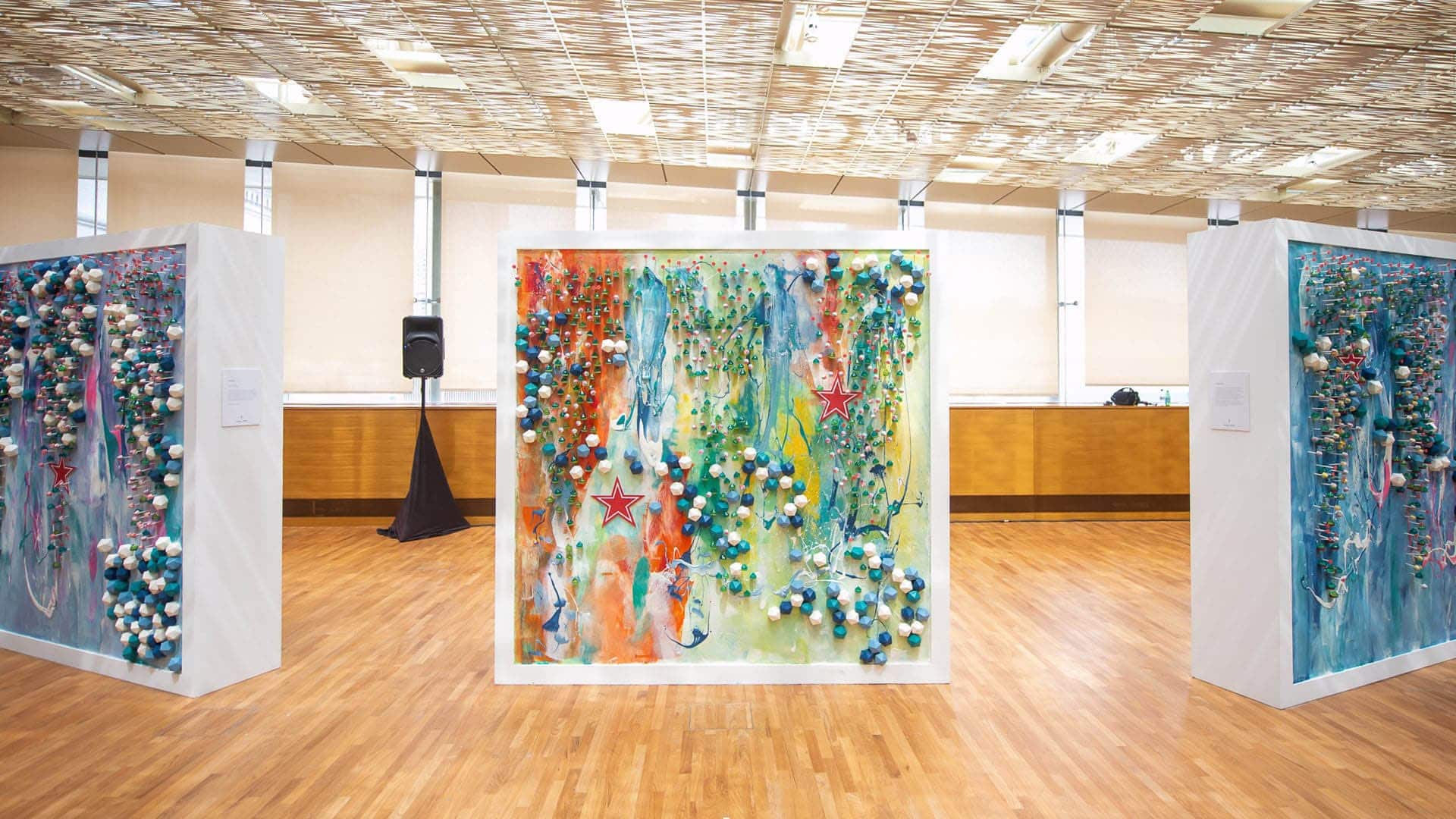 Detail of a colorful abstract painting with S.Pellegrino Star Logo