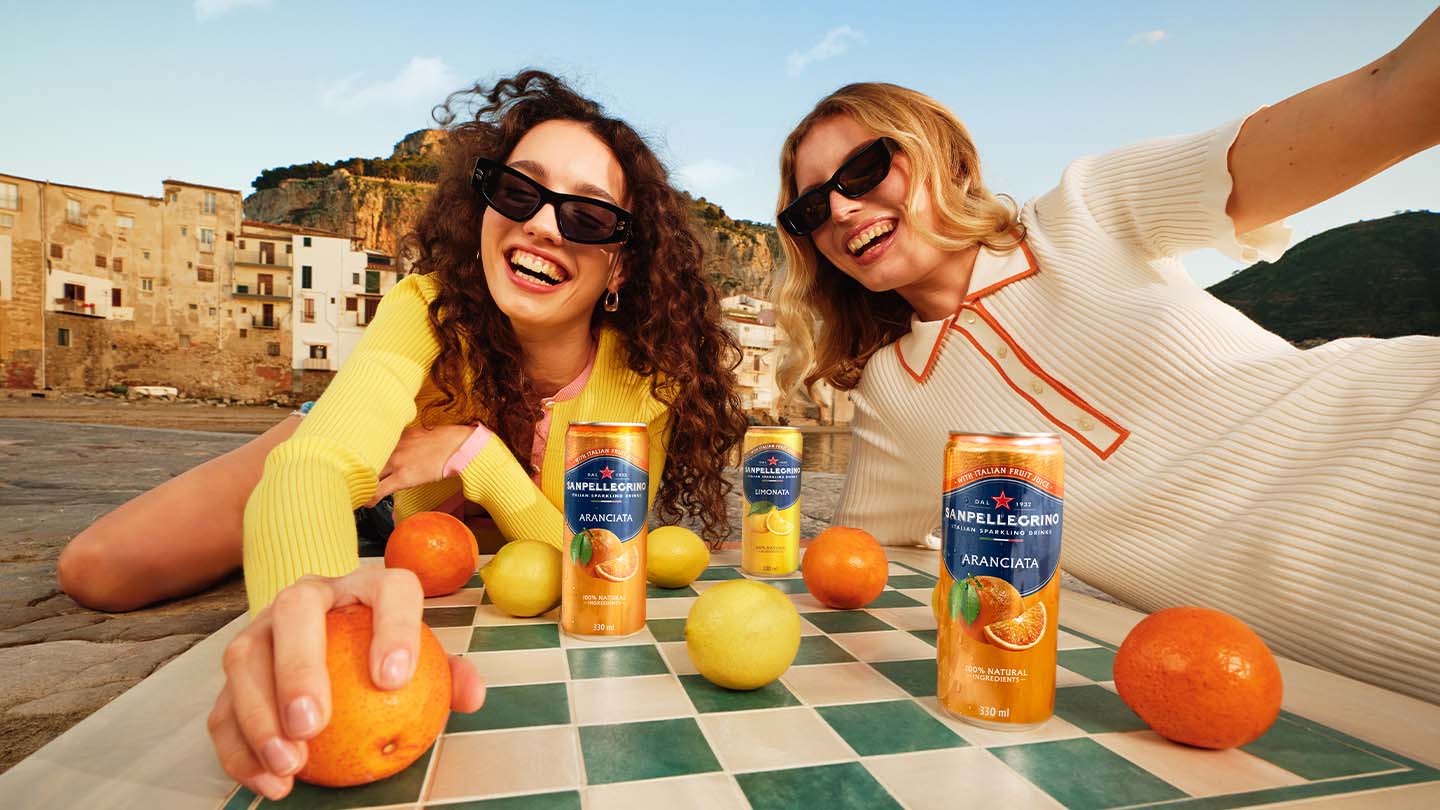 sanpellegrino drink cans on a table thumb