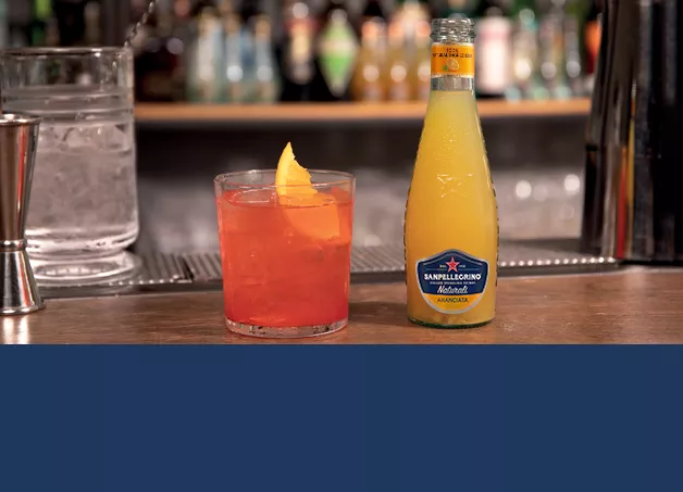 sanpellegrino garibaldi cocktail with aranciata glass