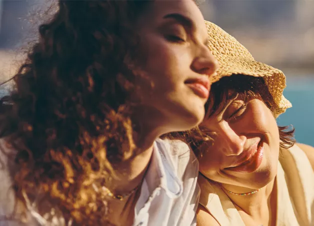 girls relaxing by seaside
