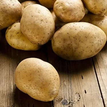 a large potato is combined with other ingredients for the stuffed of the squids