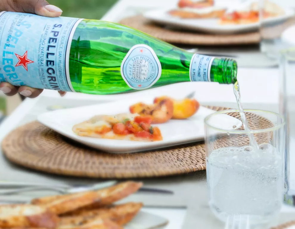 Pouring S.Pellegrino Natural Mineral water