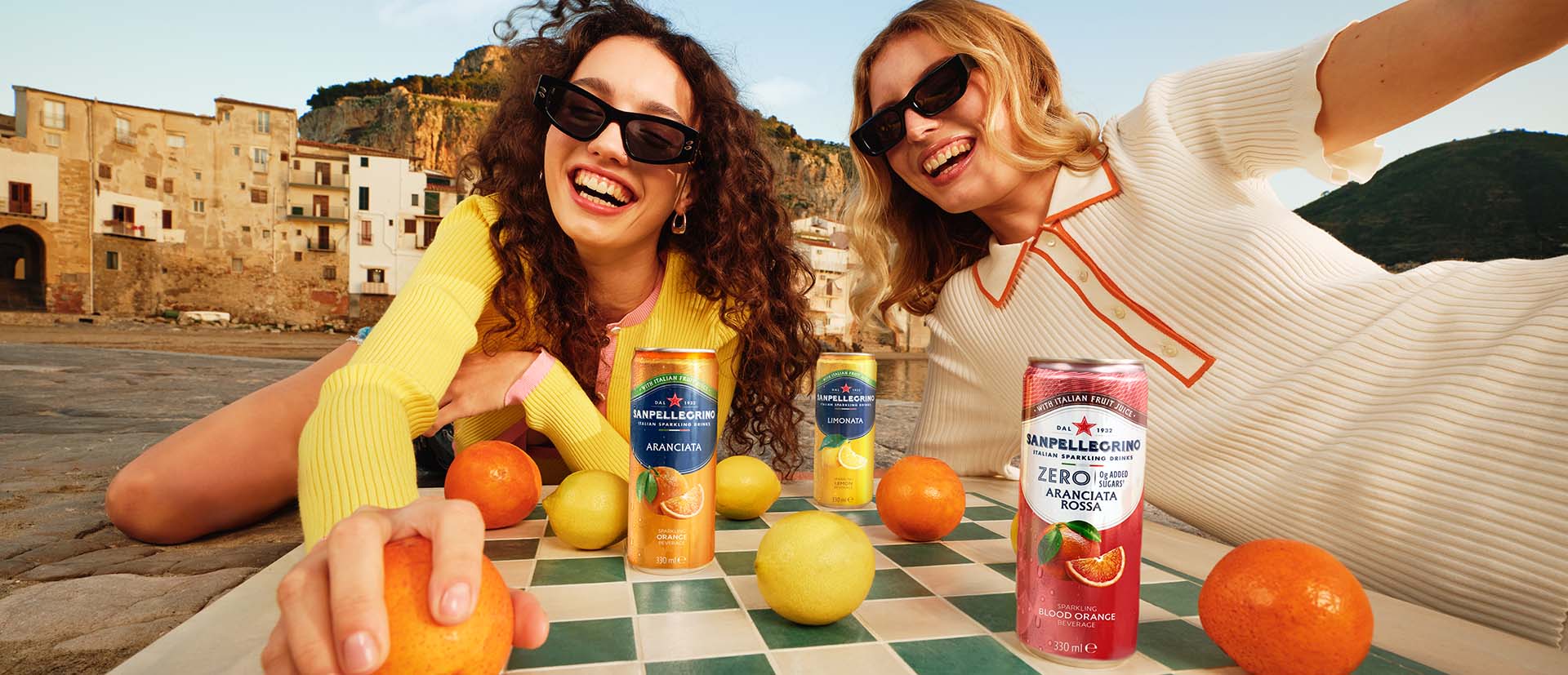 girls playing chess with sanpellegrino cans header hero carousel