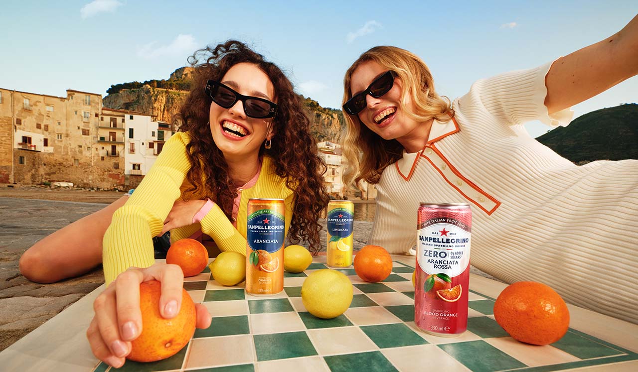 two girls playing chess with cans