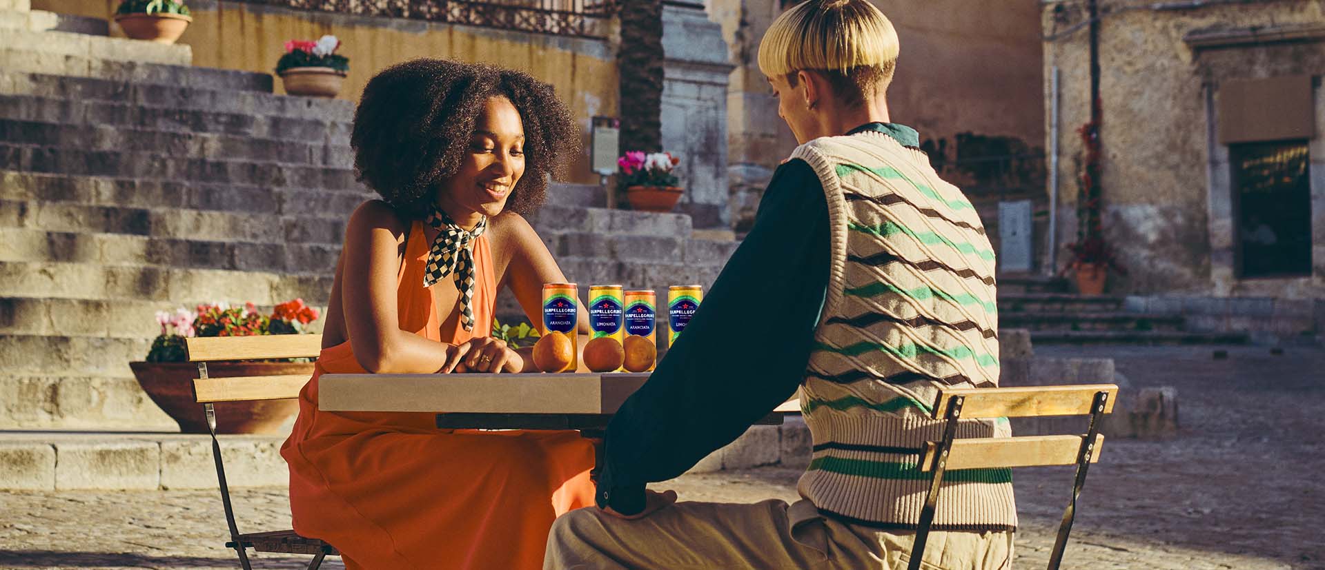 two guys playing chess with cans