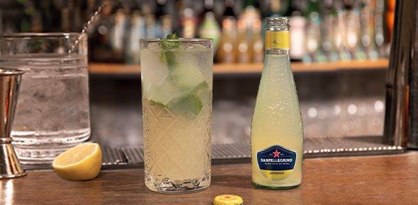 Sanpellegrino Smash Cocktail with a bottle of Sanpellegrino Limonata classic