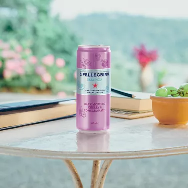 S.Pellegrino Essenza Dark Morello cherry on a table in the open air