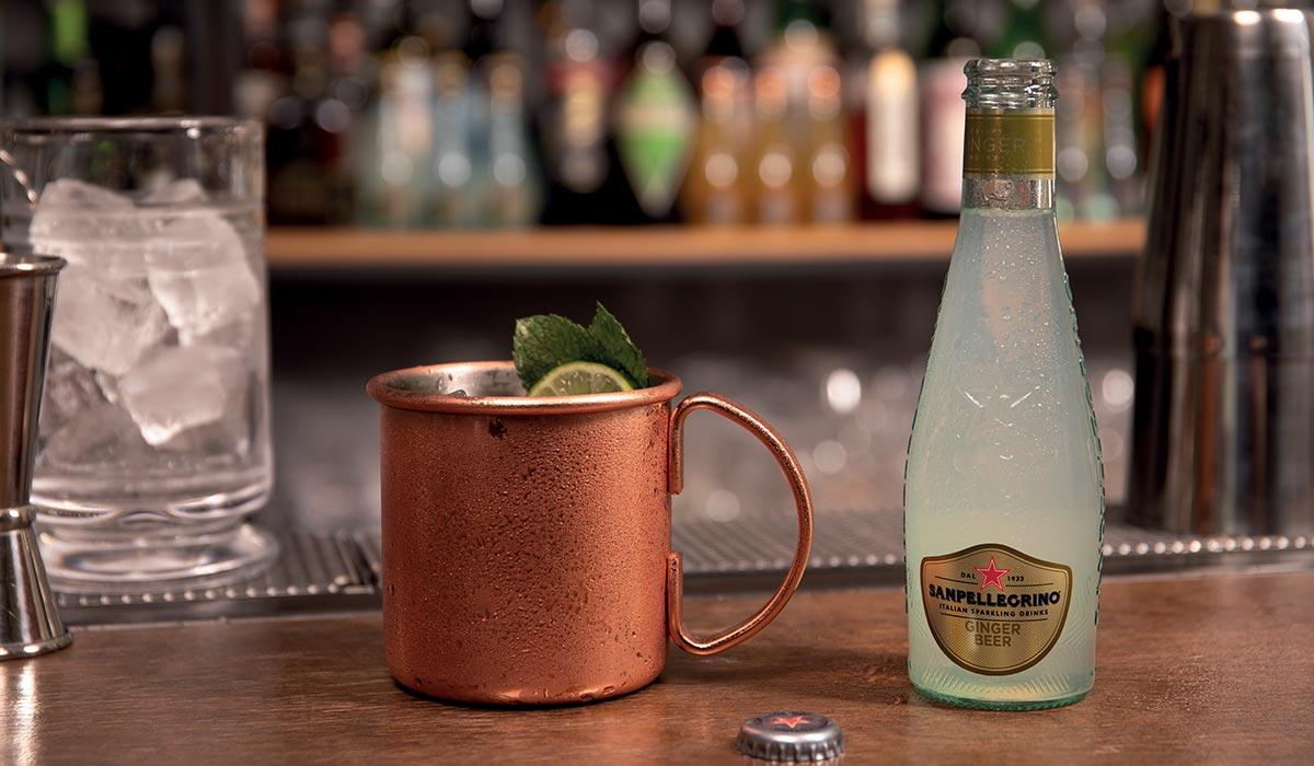 mule-cocktail-sanpellegrino-ginger-beer.jpg Sanpellegrino Mule Cocktail with a bottle of Sanpellegrino Ginger Beer