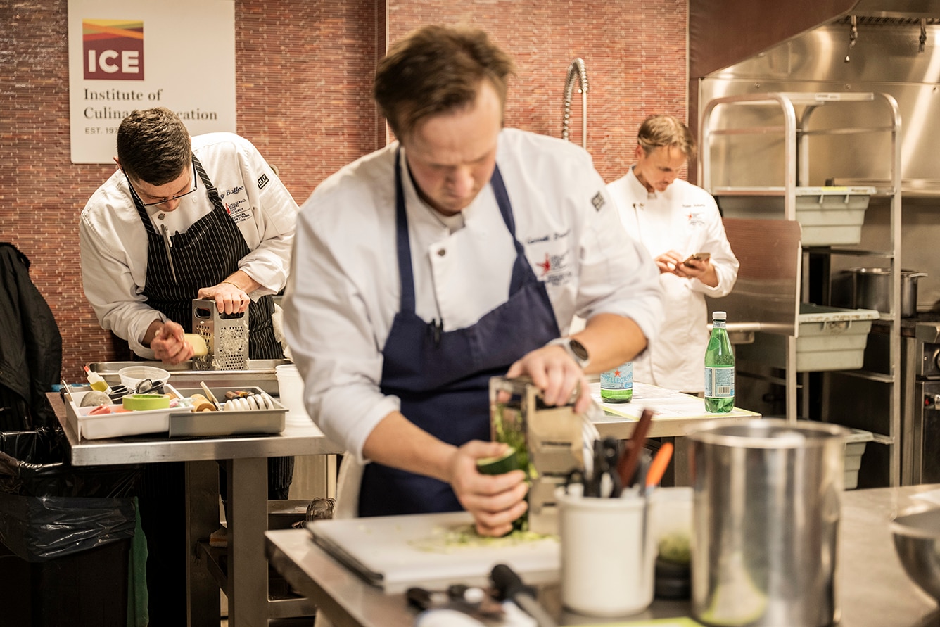 Chefs work on their creations in a cooking competition