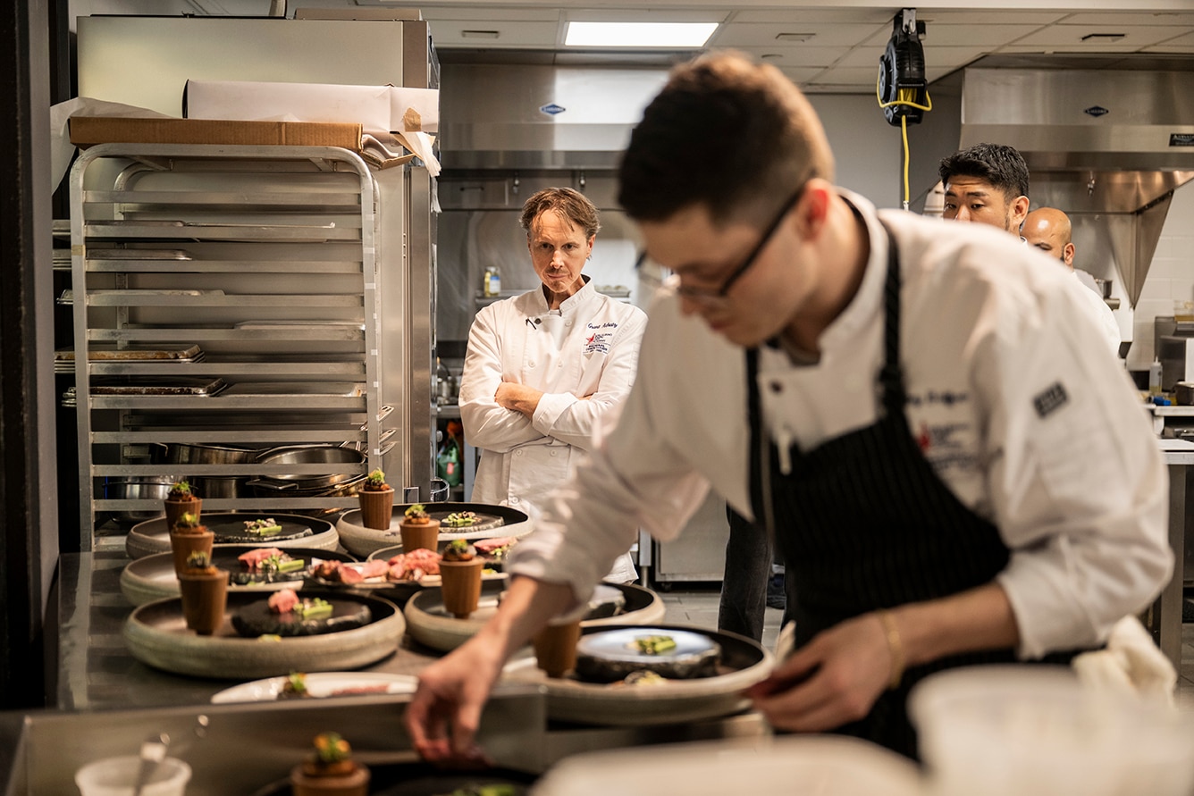 A chef works in an industrial kitchen