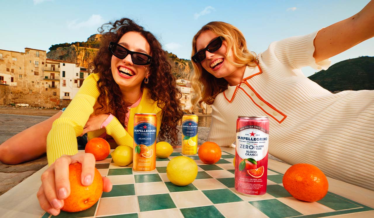 two girls playing chess with cans