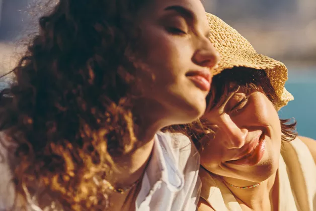 girls relaxing by seaside